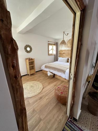 a bedroom with a bed and a large mirror at Grip Sea Morocco in Agadir