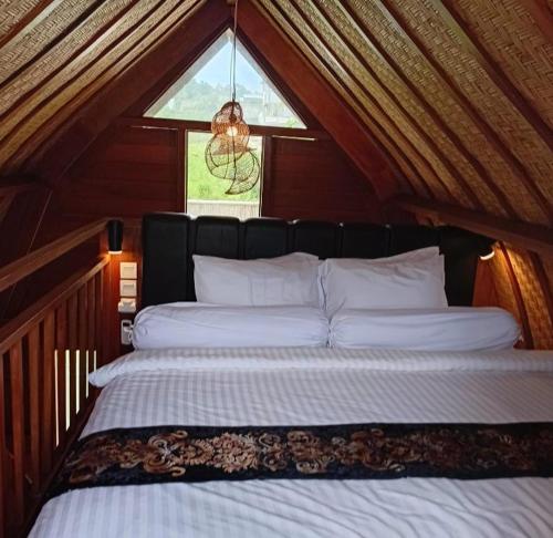 Postel nebo postele na pokoji v ubytování Tula bali bungalow