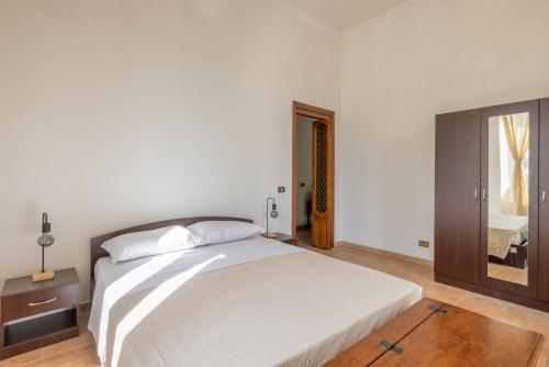 Ένα ή περισσότερα κρεβάτια σε δωμάτιο στο Piramide Maison-Rustic Elegance in Rome