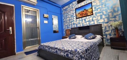 Ένα ή περισσότερα κρεβάτια σε δωμάτιο στο Banjara House n Cafe