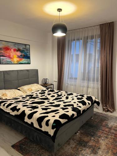 Ένα ή περισσότερα κρεβάτια σε δωμάτιο στο Beatrice Residence Centru Vechi