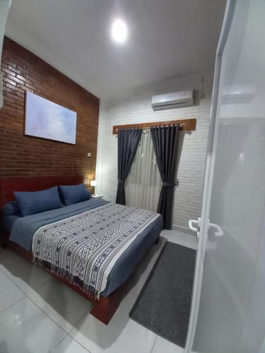 Ένα ή περισσότερα κρεβάτια σε δωμάτιο στο Guest House B