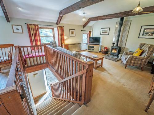 an overhead view of a living room with a staircase at 5 Swallowholm Cottages in Richmond