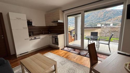 Kuchyň nebo kuchyňský kout v ubytování Bergzauber Appartement Stubai