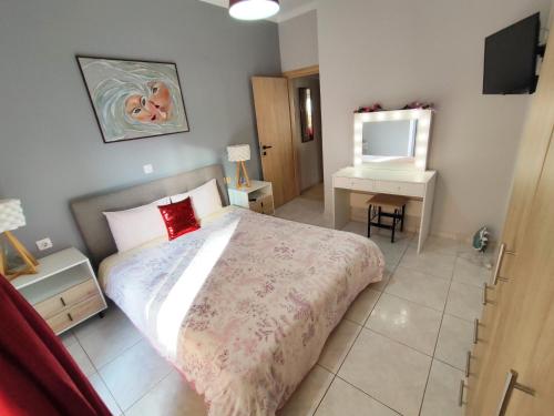 a bedroom with a large bed and a mirror at Marlen House Chania in Chania