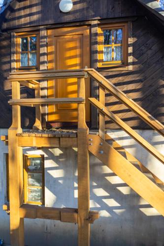 an overhead view of a house with a wooden staircase at U Kováře Matěje in Dřevíkov