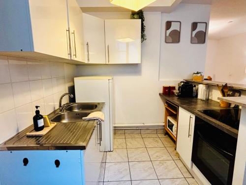 Kuchyň nebo kuchyňský kout v ubytování Coeur de ville - Spacieux 2 chambres