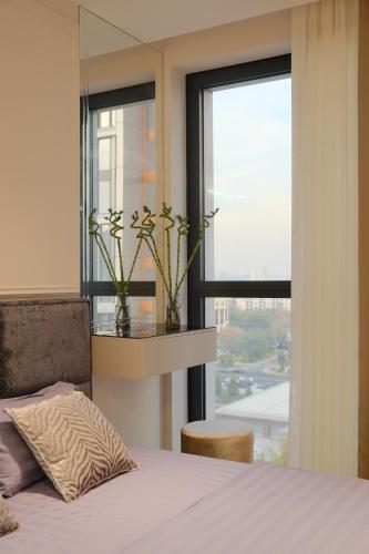 Postel nebo postele na pokoji v ubytování Nest One Luxe, Элитные апартаменты с балконом и видом на фонтан Tashkent City Park 110