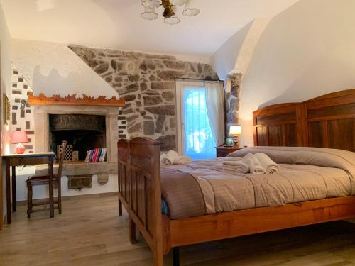 Giường trong phòng chung tại Casa Amadio - stile rustico comfort moderno