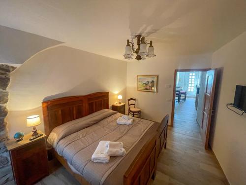 Giường trong phòng chung tại Casa Amadio - stile rustico comfort moderno