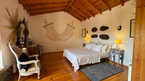 Ένα ή περισσότερα κρεβάτια σε δωμάτιο στο Casal da Serrana