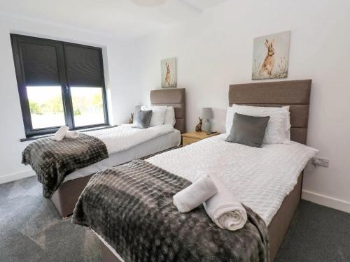 En eller flere senge i et værelse på Silverbirch Cottage - 3 Bedrooms - Sleeps 6