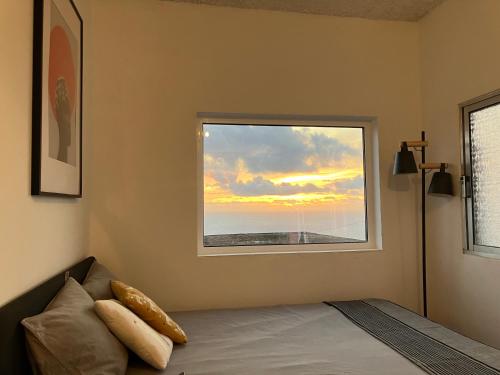 Ένα ή περισσότερα κρεβάτια σε δωμάτιο στο Ocean Studio