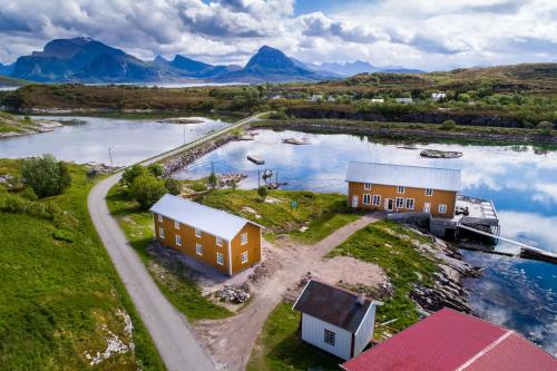 an aerial view of a house next to a river at STØTT top of Helgeland in Støtt