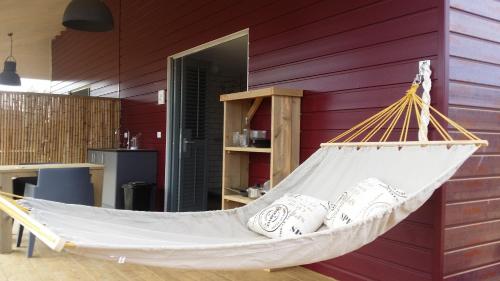 a hammock hanging from a wall in a room at Red Palm Village in Kralendijk