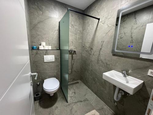 Koupelna v ubytování Aqua Rooms Ribnik