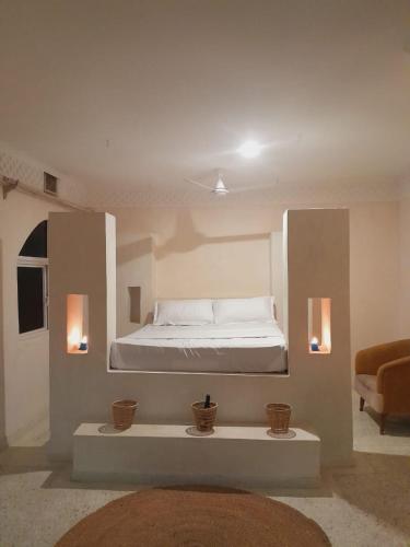 a bedroom with a bed in a room at Villa Paradise in Diani Beach