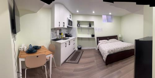 a small bedroom with a bed and a table at B3 Luxury home in Mississauga nearby shipping center square one in Mississauga