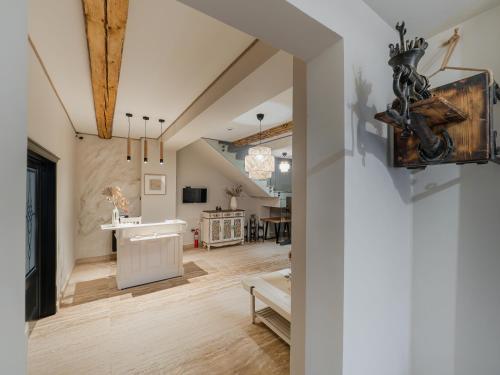 an open living room with white walls and wooden floors at Casa Breslelor in Sibiu