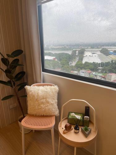 a room with a chair and a large window at A and A Place - Tower C - Free Parking in Taytay