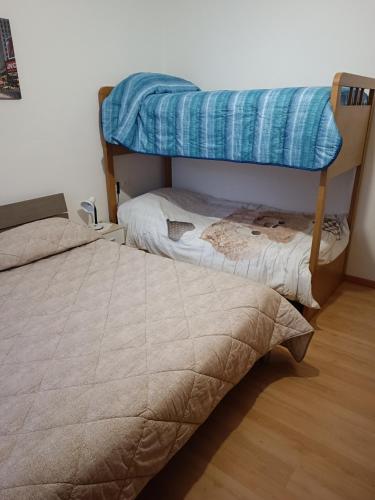 Postel nebo postele na pokoji v ubytování Appartamento la Madonnina