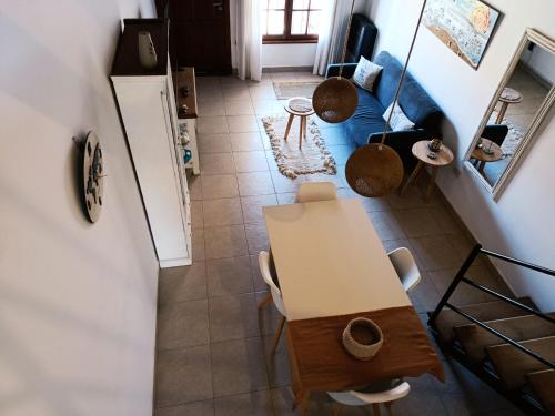 an overhead view of a kitchen with a table and a refrigerator at Arena Duplex in Necochea