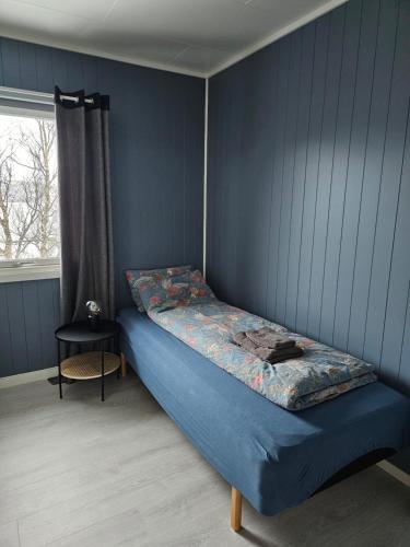 Ένα ή περισσότερα κρεβάτια σε δωμάτιο στο Senja Sjøtun House