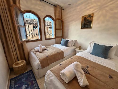 Ένα ή περισσότερα κρεβάτια σε δωμάτιο στο house in Chefchaouen