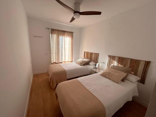 En eller flere senge i et værelse på Rincón del Mar