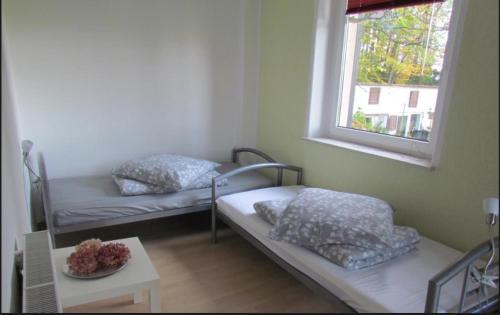 Postel nebo postele na pokoji v ubytování Ferienwohnung am Wolfsberg