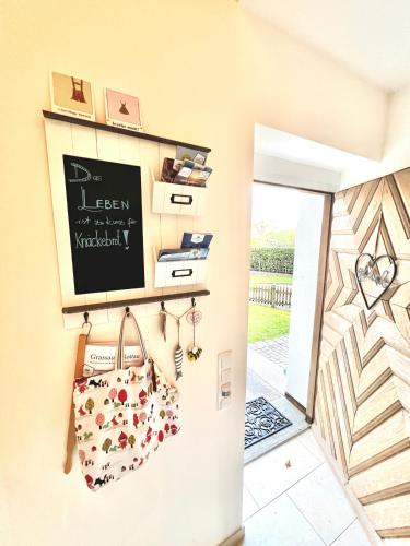 a room with a door and a chalkboard on the wall at Auszeit im Chiemgau in Rottau