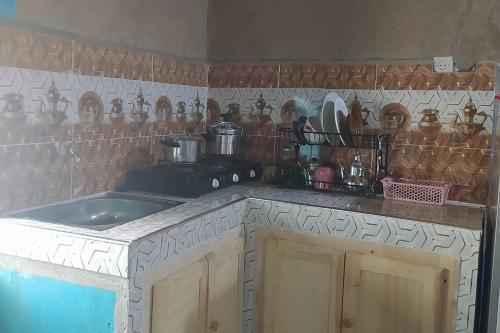 a kitchen with a sink and a counter top at Desert house in Merzouga