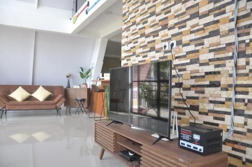 TV a/nebo společenská místnost v ubytování Toba-A-Scape