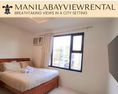 a bedroom with a bed with a teddy bear on it at BREATHTAKING BAY AND CITY VIEWS- 1-5 BR Luxury and Superior Condos with, Balcony, Pool, Netflix & Gym- Housekeeping Available - in Manila