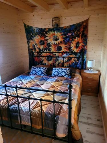 a bedroom with a bed in a log cabin at Villa Luna in Boa Viagem