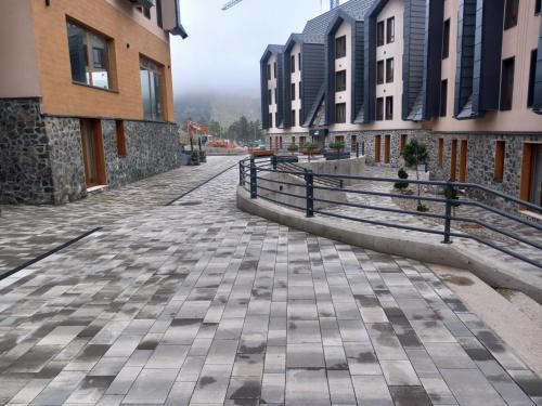 an empty street in a city with buildings at Stela Divcinova in Divčibare