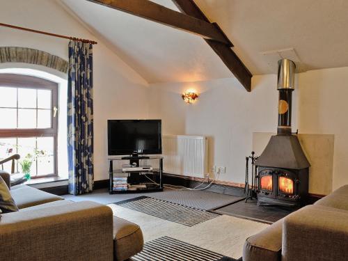 TV a/nebo společenská místnost v ubytování The Granary