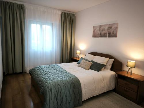 En eller flere senge i et værelse på Quinta da Barca Guest House