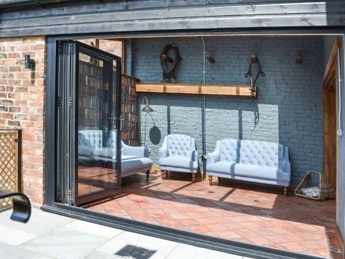a group of blue chairs sitting in a building at The Old Stables in Tickton