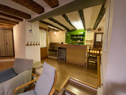 a living room with a couch and a table at Casa Narcís in Claverol