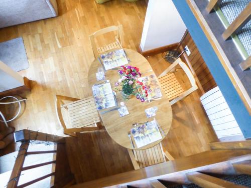 an overhead view of a dining room table with flowers at Southview in Porchfield