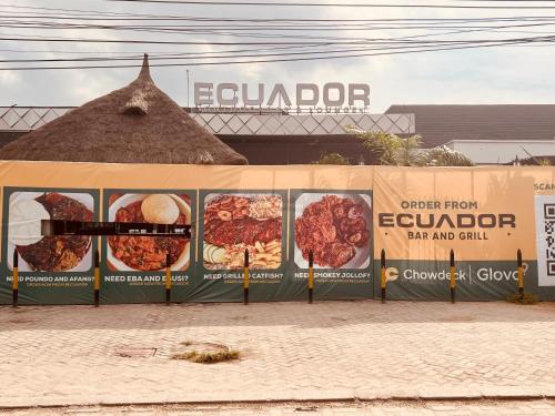 a food stand with signs on the side of it at Bytup 2bedroom Apt in lekki,24hrs light, Wifi ,fully serviced apartment , water heater smart tv in Lekki