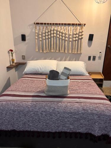 a bed with a box on top of it at Nanabi in Brisas de Zicatela