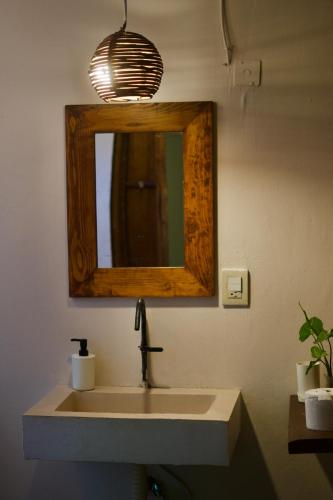 a bathroom with a sink and a mirror at Nanabi in Brisas de Zicatela