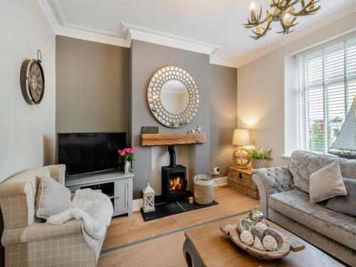 Et opholdsområde på Neptune Cottage