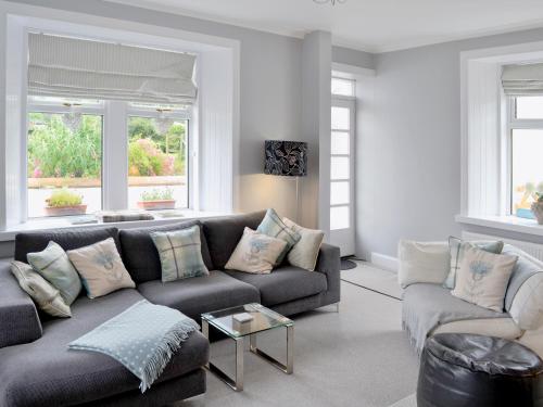 a living room with a couch and two couches at Balcary Mews Cottage in Auchencairn