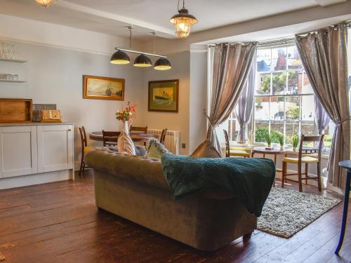 a living room with a couch and a table at Duke Of Wellington Hq in Hastings