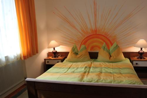 a bedroom with a bed with a wooden headboard at Ferienwohnung Winklhofer in Mondsee