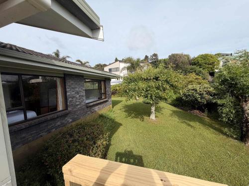 a view of a yard of a house at Kiwi Classic in Red Beach