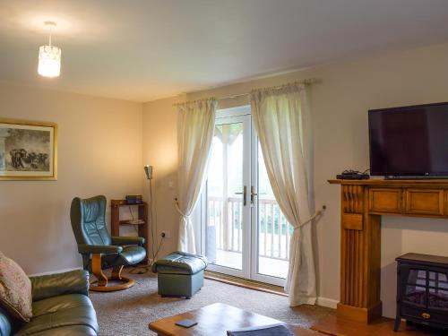 TV a/nebo společenská místnost v ubytování The Lodge